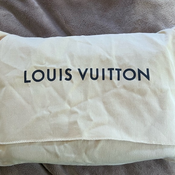 This is my black Louis Vuitton messenger bag, wore it one time perfectly good. - Picture 6 of 9